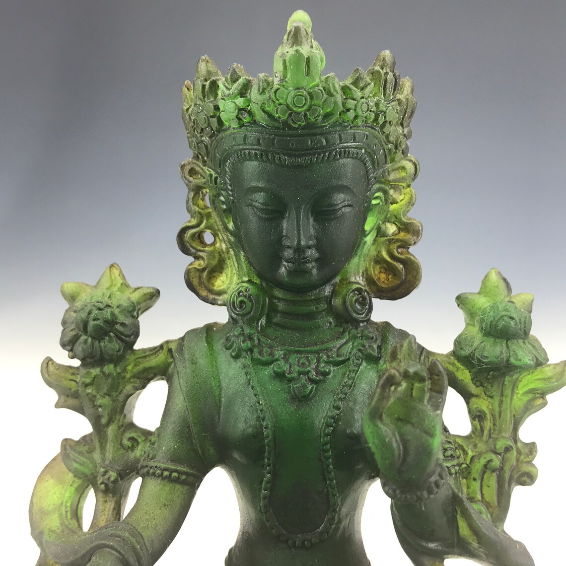 A statue of Buddha made of ancient glass in China Etsy