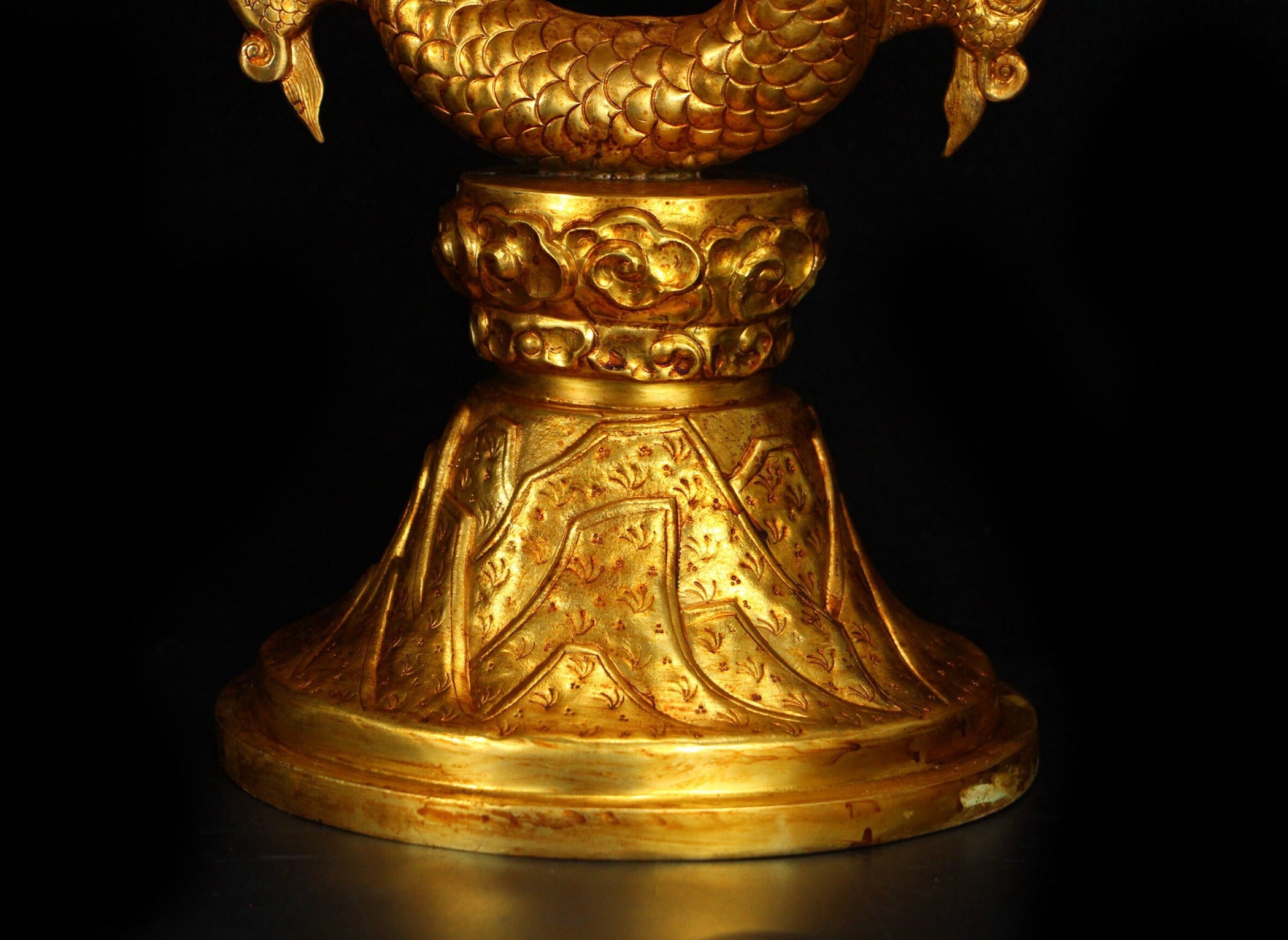 A gilt dragon candlestick from the Qing Dynasty from the Etsy