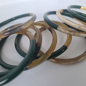 Natural and green tinted buffalo horn rush