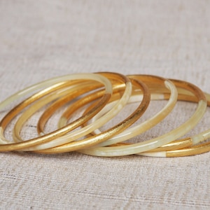 Bracelet, buffalo horn bangle plated with gold leaf