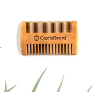 May include: A wooden beard comb with the words "CastleBeard" engraved on the handle.