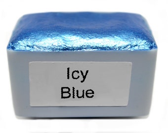May include: A small, square container of metallic blue watercolor paint. The label reads "Icy Blue".