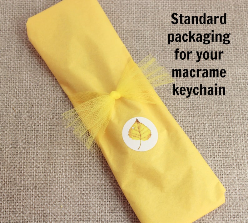 My standard packaging for these keychains is yellow tissue paper, a tulle bow, and my aspen leaf sticker.  They are ready to give just like this, or you can also add optional gift wrap.