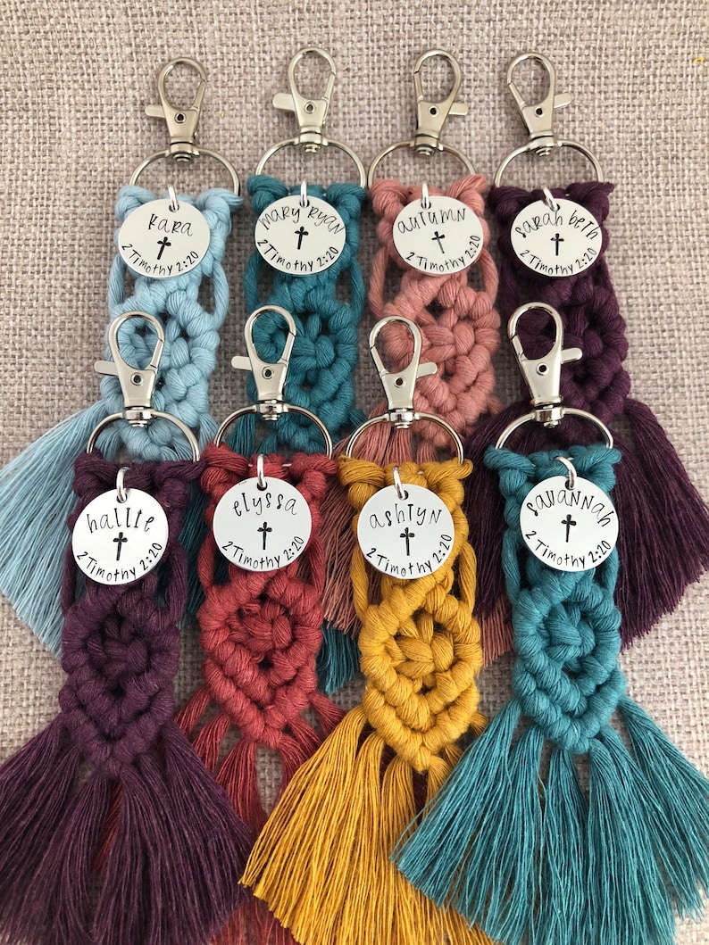 5" long macrame keychain with personalized discs featuring a cross, name, and Bible verse.  These keychains come in a variety of colors and are fully customized