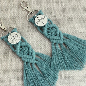 5" long macrame keychain with personalized discs featuring a cross, name, and Bible verse.  These keychains come in a variety of colors and are fully customized