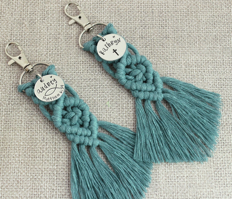 5" long macrame keychain with personalized discs featuring a cross, name, and Bible verse.  These keychains come in a variety of colors and are fully customized