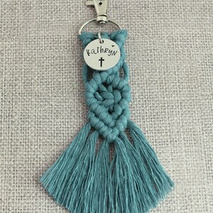 5" long macrame keychain with personalized discs featuring a cross, name, and Bible verse.  These keychains come in a variety of colors and are fully customized