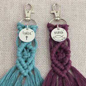 5" long macrame keychain with personalized discs featuring a cross or ichthys, name, and Bible verse.  These keychains come in a variety of colors and are fully customized