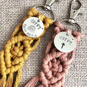 5" long macrame keychain with personalized discs featuring a cross or rainbow, name, and Bible verse.  These keychains come in a variety of colors and are fully customized