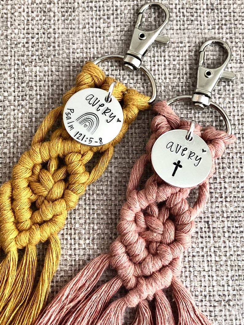 5" long macrame keychain with personalized discs featuring a cross or rainbow, name, and Bible verse.  These keychains come in a variety of colors and are fully customized