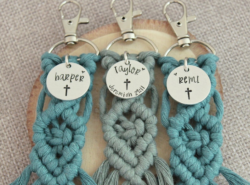 5" long macrame keychain with personalized discs featuring a cross, name, and Bible verse.  These keychains come in a variety of colors and are fully customized