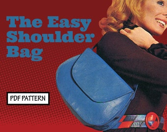 May include: A blue shoulder bag with a flap closure. The bag is worn by a woman with blonde hair. The text "The Easy Shoulder Bag" and "PDF PATTERN" is visible on the image.