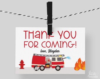 May include: Red and white thank you card with a fire truck, a fire hydrant, and flames. The text on the card reads "Thank you for coming! love, Hayden".