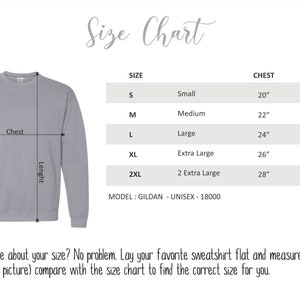 May include: Size chart for a sweatshirt with measurements in inches for chest and length. Sizes include small, medium, large, extra large, and 2 extra large. The model is Gildan Unisex-18000.