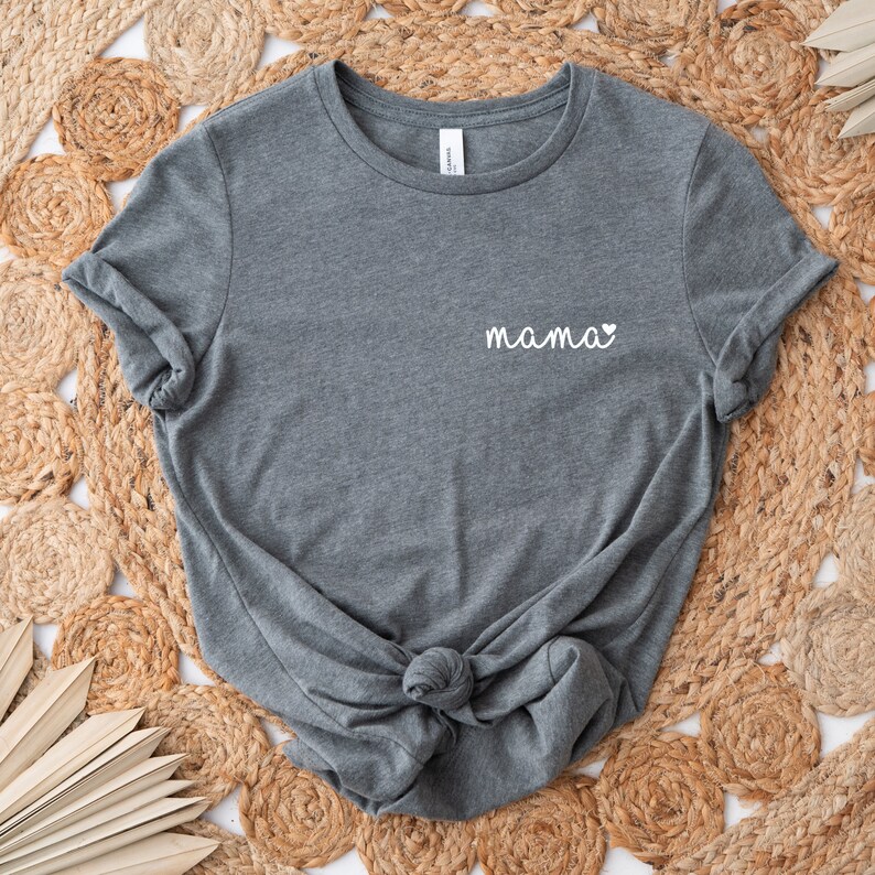 A heather gray t-shirt with the word "mama" and a small heart pocket design  on the front. Mama Pocket Design TShirt Minimalist Mom Gift Cute Boy Mom Shirt Trendy Girl Mama Apparel Mothers Day Gift Bella Canvas Shirt