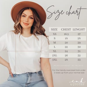 May include: A white t-shirt with a size chart, featuring chest and length measurements in inches. The chart includes sizes XS to 3XL. The text "Size chart" is at the top. The brand name "ink & QUOTES" is at the bottom.