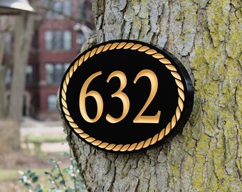 Placa de dirección ovalada tallada con diseño de borde de cuerda