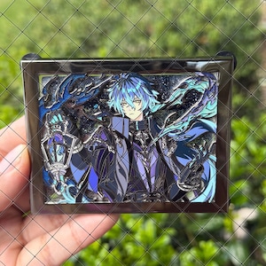 May include: A rectangular metal enamel pin featuring an anime-style character with blue hair, wearing a dark purple and black outfit. The character holds a lantern, surrounded by swirling blue flames against a dark, glittery starry background.