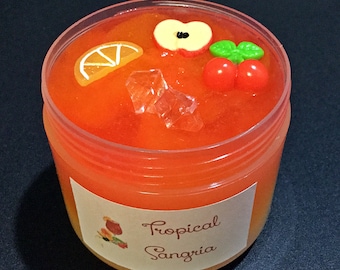 Tropical Sangria - a jelly slime with layers fading from yellow to red with a fruity scent. Comes with several charms
