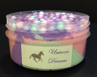 Unicorn Dreams -  tricoloured slay slime topped with foam beads.  Comes with a  cute unicorn charm.