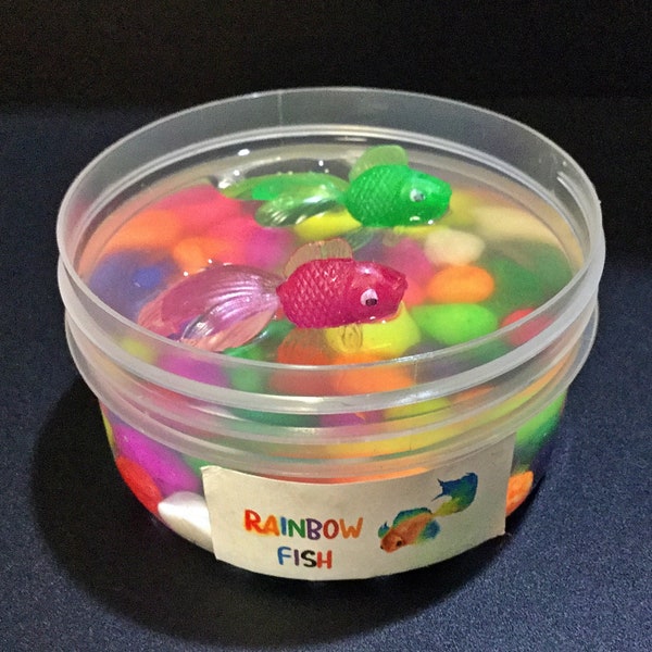 Rainbow Fish - Clear slime  with multicolored pebbles.  Comes with two fun, brightly coloured fish charms