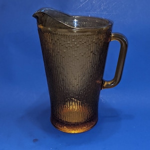 Vintage amber glass pitcher, pattern looks like bamboo