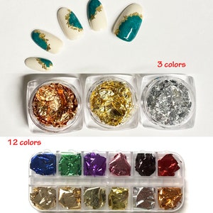 May include: Three small jars of gold, silver, and copper nail foil flakes. A larger container with 12 compartments of different colored nail foil flakes. The foil flakes are used for nail art.