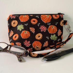 Herbst Kürbisse und Donuts Reißverschluss / Handgelenktasche
