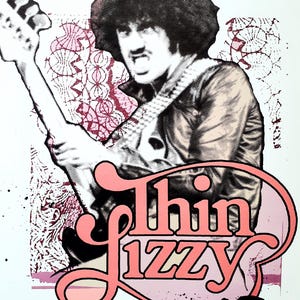 May include: A poster with a black and white illustration of a musician playing a guitar, with the band name "Thin Lizzy" in pink script. The background has a pink and white pattern, with the band's name in a pink oval.