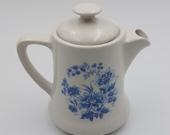 Porcelain milk jug with hand-painted blue floral decoration