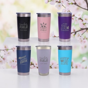 May include: A selection of six stainless steel tumblers in colours like black, pink, and blue. Each tumbler has text and graphics, including "Teacher Fuel" and "Best Teacher Ever." These tumblers are designed for teachers.