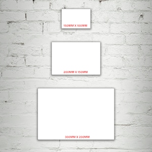May include: Three white rectangular frames of different sizes against a white brick wall. The frames are labeled with their dimensions in millimeters: 150mm x 100mm, 200mm x 150mm, and 300mm x 200mm.