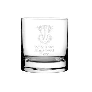 May include: A clear glass tumbler with an etched design of three darts and a laurel wreath. The text "Any Text Engraved Here" is also etched on the glass.