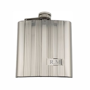 May include: A silver hip flask with a ribbed design and a hinged cap. The flask has the initials "R.M." engraved on the front.