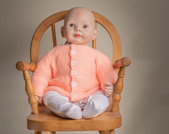 Baby Jacket in peach, 0-3 months, button fastening, machine washable at 40 degrees, acrylic yarn