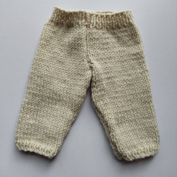 Handknitted trousers in biscuit for 14 inch toy doll, reborn baby or small premature baby. Acrylic yarn and machine washable