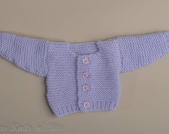 Handknitted cardigan in lilac colour for 16 inch doll or medium premature baby. Acrylic yarn and machine washable