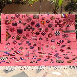 Awal - Dusty Rose Taznakht Rug | Vibrant Amazigh Symbol Wool Carpet | Handmade Moroccan Heritage Art Piece