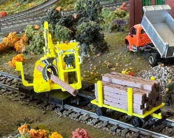 HO & O Scale CAT Railroad Tie Loader with loaded cart in Yellow or Orange unpainted