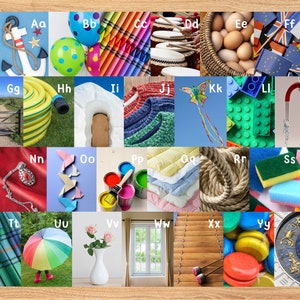May include: Alphabet flash cards with colorful images representing each letter.  The images include an anchor, crayons, drums, eggs, a flag, a gate, a garden hose, a knitted sweater, a kite, building blocks, a magnet, a necklace, origami stars, paint cans, a quilt, rope, a sponge, a kilt, an umbrella, roses in a vase, a window, xylophone mallets, yo-yos, and a compass.