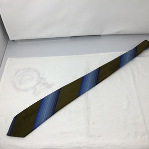 May include: A striped tie with blue and brown stripes. The tie is made of a silky material.