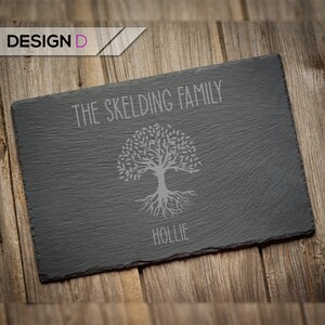 May include: A black slate serving tray with a tree design and the text "THE SKELDING FAMILY HOLLIE" engraved on it.