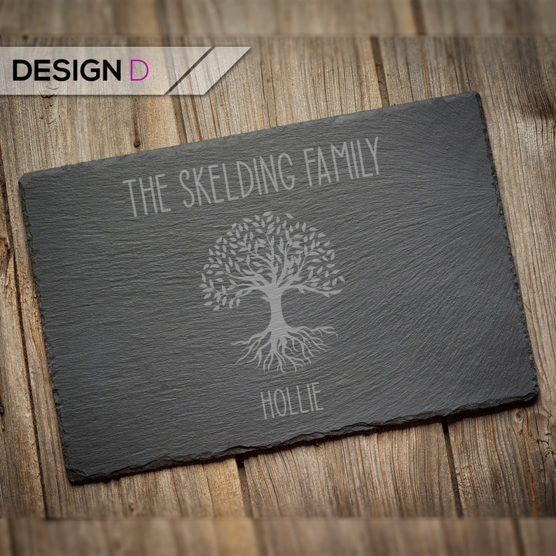 May include: A black slate serving tray with a tree design and the text "THE SKELDING FAMILY HOLLIE" engraved on it.