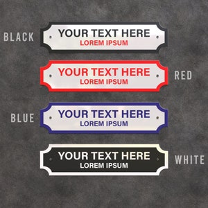 May include: Four rectangular signs with curved edges, each displaying the text "YOUR TEXT HERE" and "LOREM IPSUM." The signs are in black, red, blue, and white, with corresponding text colours. The background is a textured grey surface.