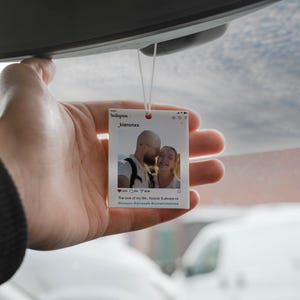 May include: A clear, rectangular car air freshener with a photo of a couple, resembling an Instagram post. The text reads "Instagram _kieronxx" and "The love of my life...forever & always xx #loveyou #drivesafe #comehometome."