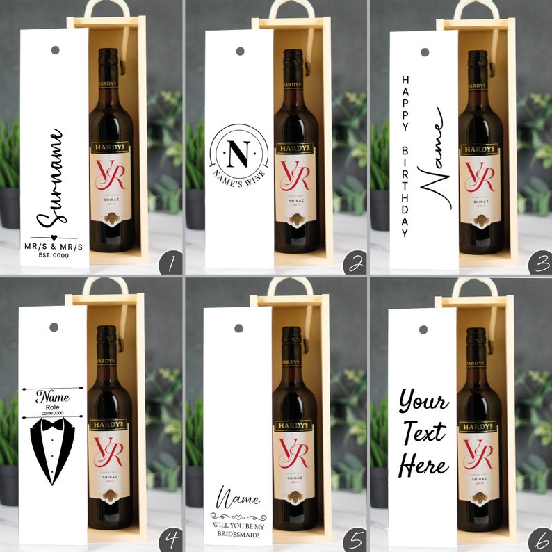 May include: Six different designs for a personalized wine gift box. The box is made of wood and has a white label with a variety of text and designs. The box contains a bottle of red wine.