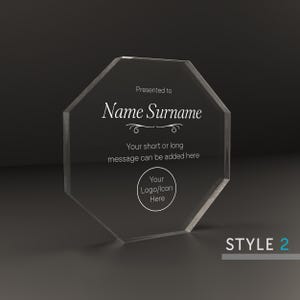 May include: A clear octagonal acrylic award plaque with the text "Presented to Name Surname" and "Your short or long message can be added here". The plaque also has a circle with the text "Your Logo/Icon Here".