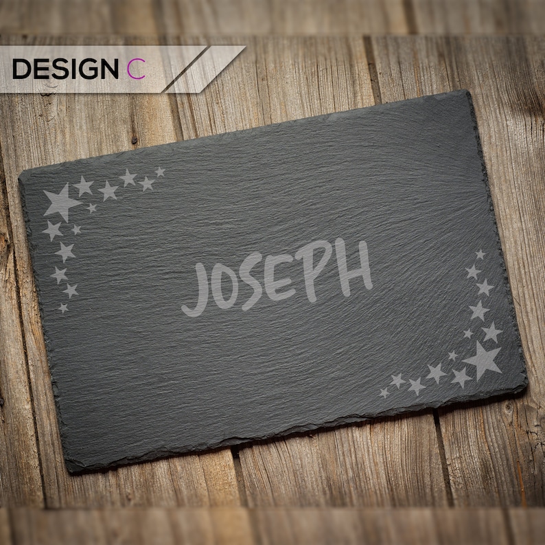 May include: Black slate serving tray with a white star design and the name "Joseph" written in white.