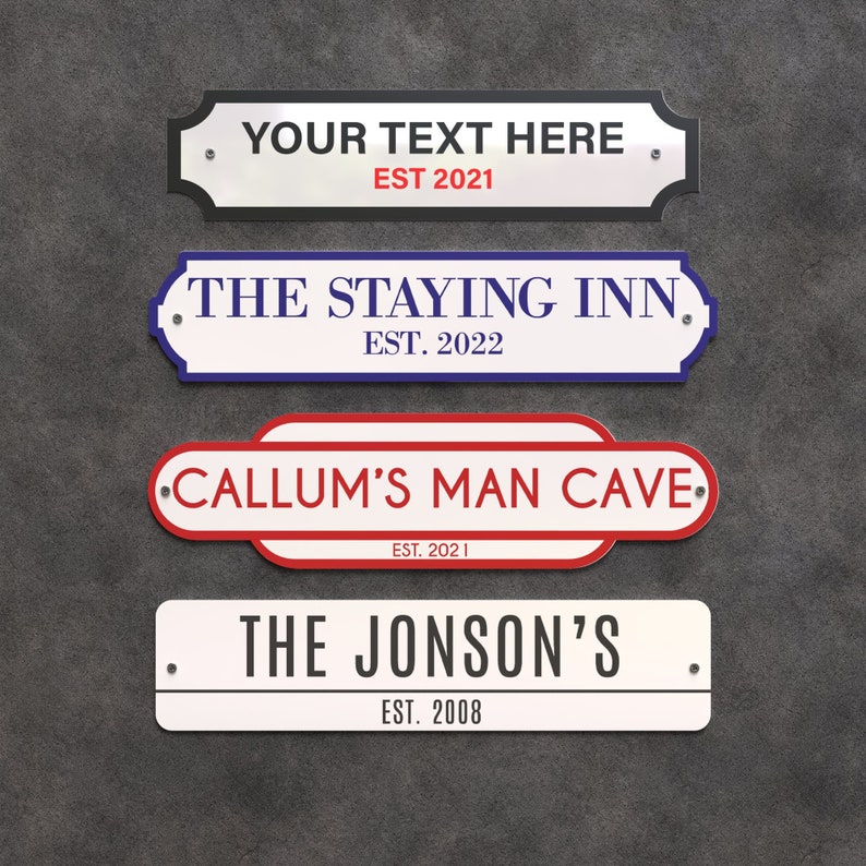 May include: Four rectangular signs with rounded edges. The top sign is white with black trim and the text "YOUR TEXT HERE" and "EST 2021". The second sign is white with blue trim and the text "THE STAYING INN" and "EST. 2022". The third sign is red and white with the text "CALLUM'S MAN CAVE" and "EST. 2021". The bottom sign is white with the text "THE JONSON'S" and "EST. 2008".