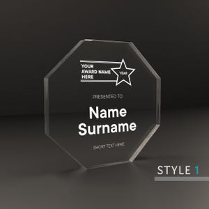 May include: A clear octagon-shaped acrylic award plaque with a star design and the text "Your Award Name Here" and "Year". The plaque also includes the text "Presented to Name Surname" and "Short Text Here".